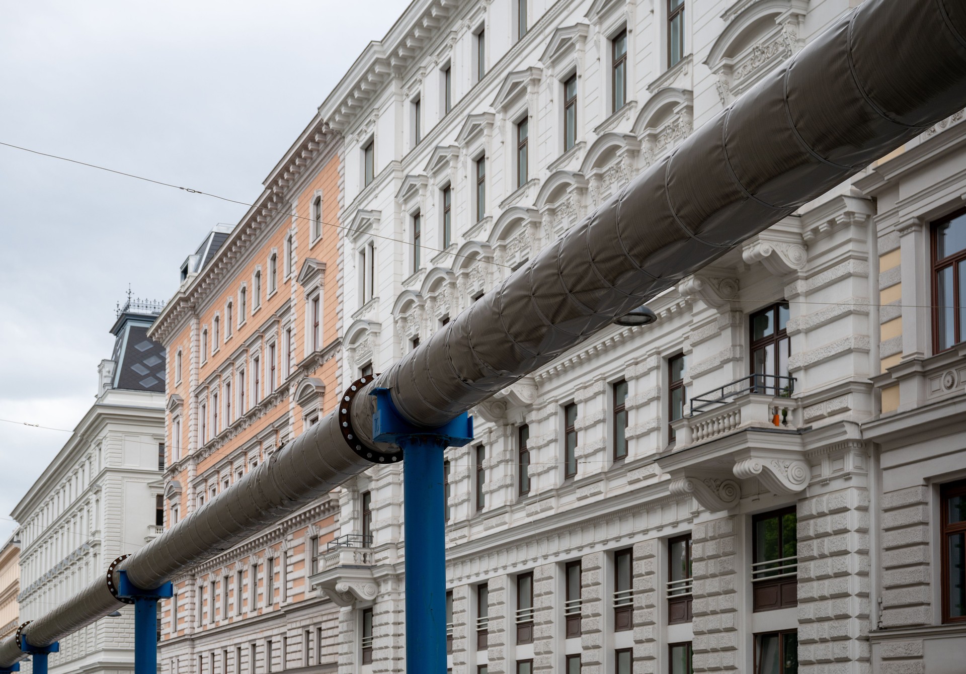 Large metal pipeline suspended on supports